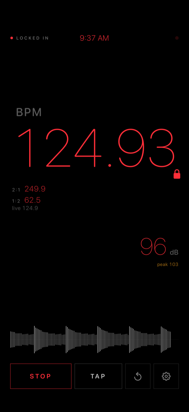 Booth Assist night mode: locked BPM readout of 124.93 in dim red, related tempos at 2:1 and 1:2, and a 96 dB level reading